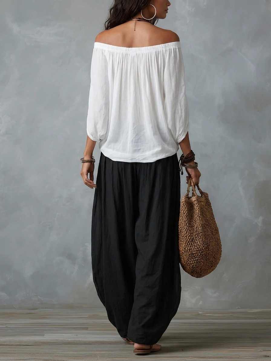 Conjunto de top blanco con hombros al aire y pantalones acampanados estilo linterna