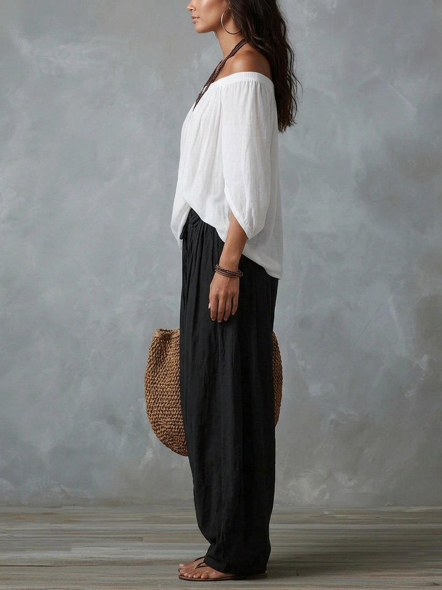 Conjunto de top blanco con hombros al aire y pantalones acampanados estilo linterna